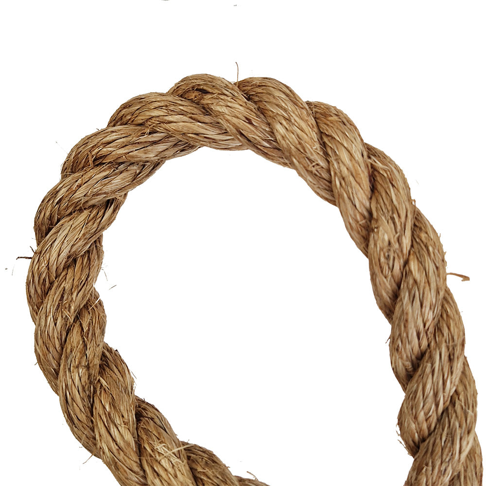 Coiled piece of brown natural rope on a white background
