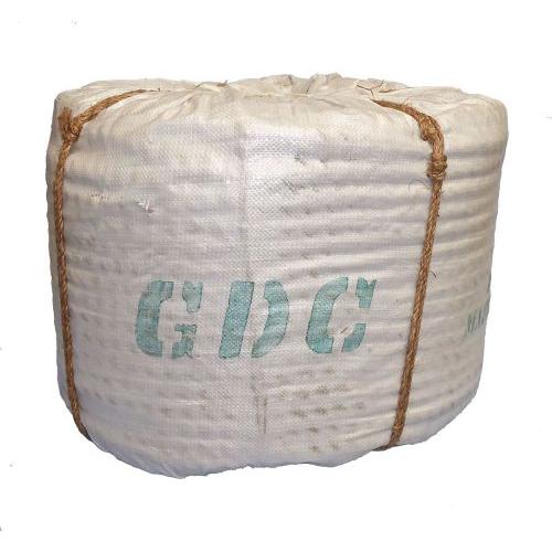 Coil of 24mm natural manila rope wrapped in white hessian and tied with brown cord.