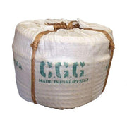 Coil of 32mm natural manila rope wrapped in white hessian and tied with brown cord.