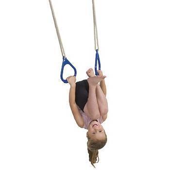 Child using a plastic gym ring set against a white background