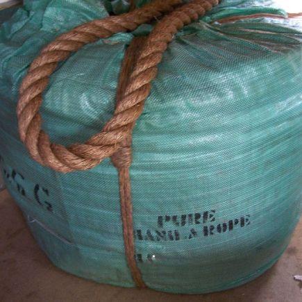 wrapped coil of 40mm natural manila rope with the end of the rope showing.