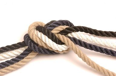 Close-up of polyester ropes in black, white, navy and beige on a white background