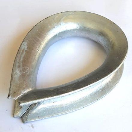 Heart shaped galvanised metal thimble for rope with a white background.
