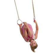A child hanging from metal gym rings with adjustable synthetic hemp ropes.