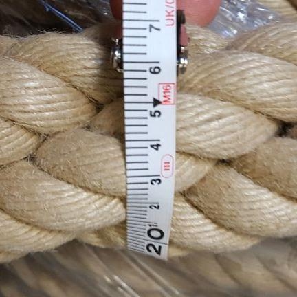 Close-up of 65mm synthetic hemp rope with a measuring tape indicating dimensions